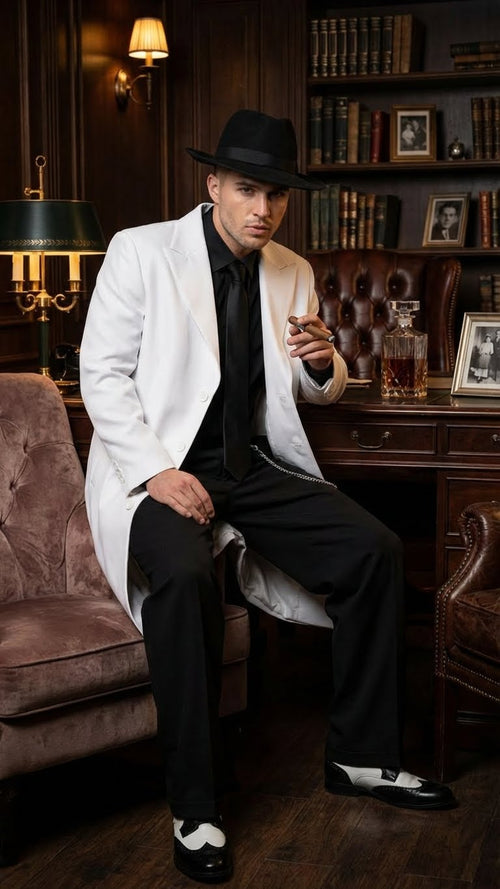 Men's white zoot suit features a long white jacket with a slightly relaxed fit, paired with black trousers. The jacket has large lapels, and the outfit includes black dress shoes with white accents.