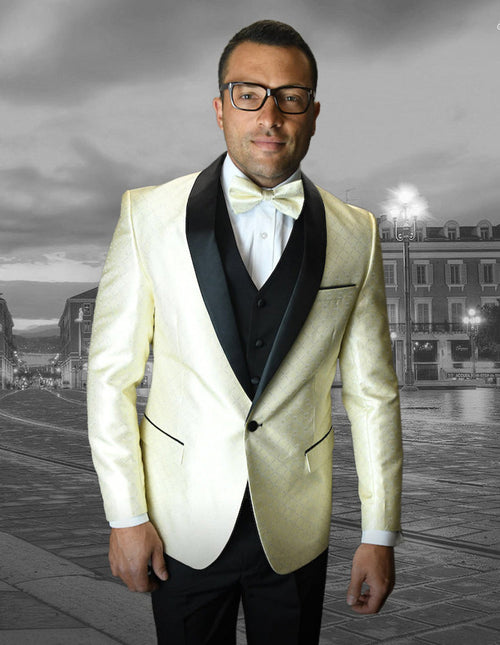 Ivory one-button shawl tuxedo with geometric chain print. Satin finish, black lapels & trim. Structured shoulders, vest visible. Paired with white shirt & bow tie.