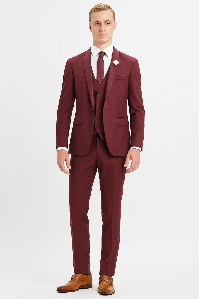 Burgundy three-piece slim fit suit for men: jacket (single-button, notch lapel), vest (three buttons), pants. Smooth fabric, tailored silhouette. Includes white shirt & burgundy tie.