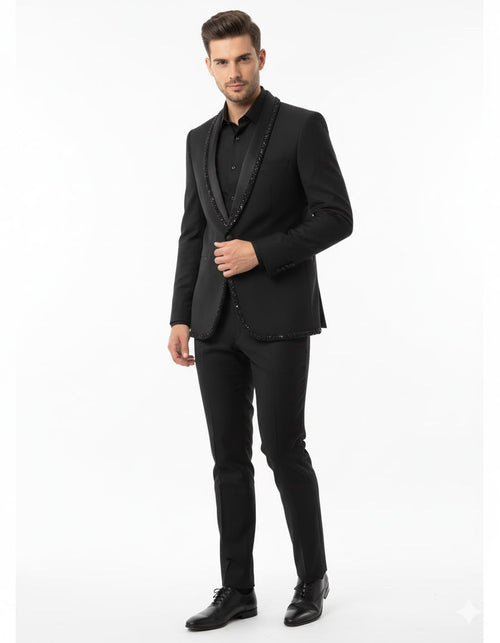 Black blazer with beaded lapel, structured fit, and single-button closure. Paired with matching black pants. Smooth fabric, classic style.
