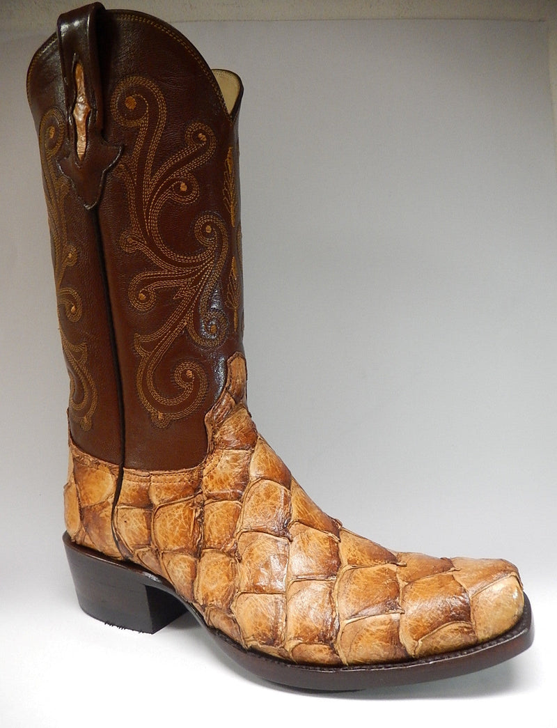 Brown leather cowboy boot with decorative stitching & fish scale-like textured pattern. Pointed toe, slight heel, tall shaft with a pull tab.