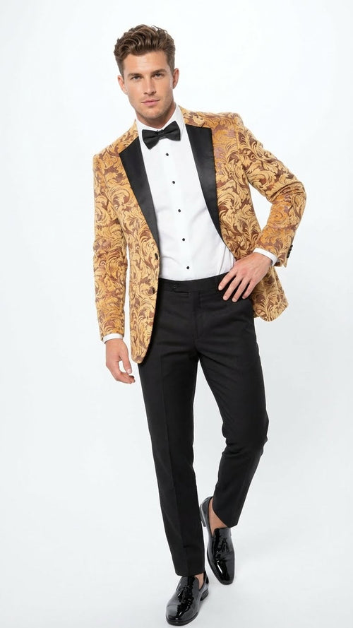 Men's yellow gold baroque tuxedo blazer: fitted, swirling gold pattern, black satin lapels. Paired with black tailored pants and shiny black shoes.