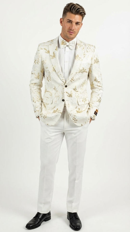 Men's white blazer with gold patterns, tailored fit. Single-breasted, two pockets. Smooth fabric with gold floral design. Worn with white pants and shirt for a monochromatic look.