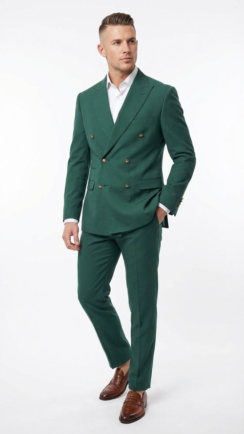 Emerald green double-breasted suit featuring gold buttons, a tailored fit, and a structured silhouette. The fabric appears smooth, with no visible pattern, complemented by matching trousers.