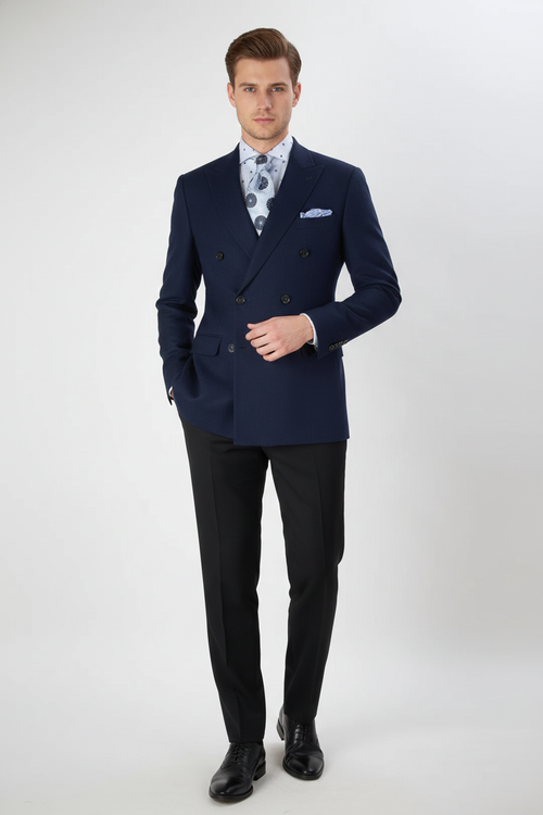 Navy double-breasted men's blazer. Structured, fitted shape with notched lapels and textured fabric. Features double-breasted buttons and a breast pocket. Deep navy color.