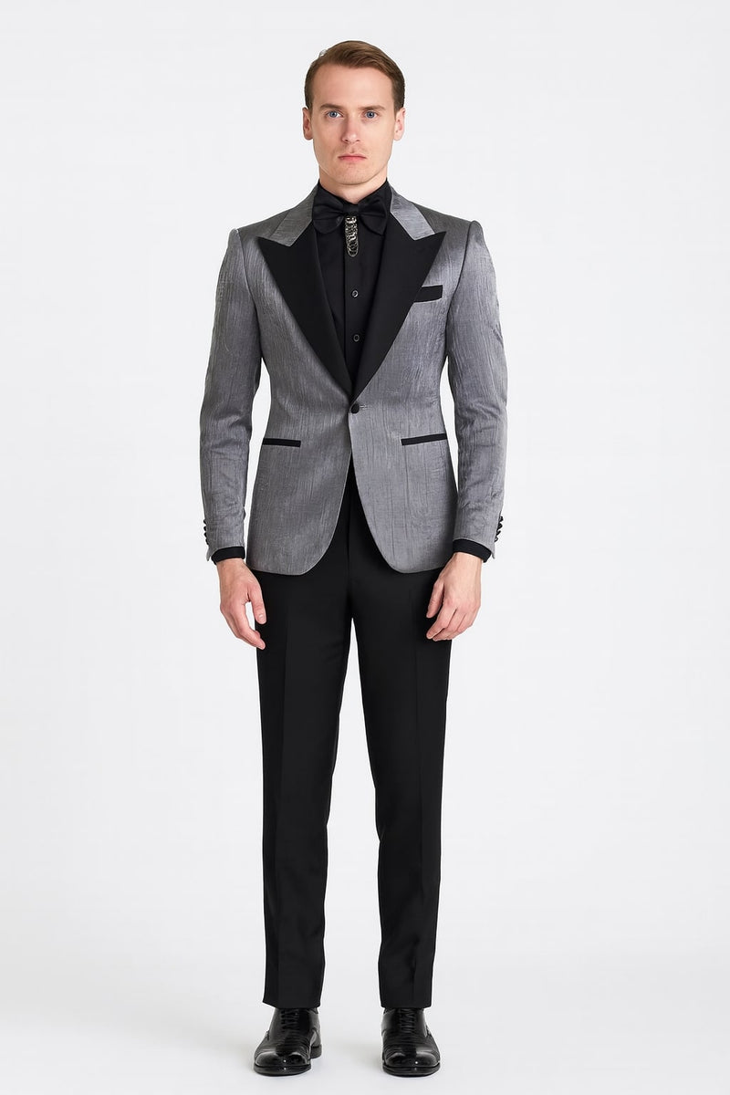 Silver metallic tuxedo with black satin peak lapel and vertical jacket stripes. Single black button, waist notch. Includes black trousers and shirt.
