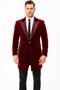 Burgundy men's tuxedo with velvet long blazer. Features single-button closure, shawl lapels, and dual side pockets. Smooth finish.