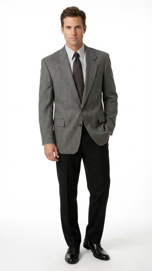 Charcoal grey men's blazer. Structured fit with padded shoulders, notched lapel, and subtle textured pattern. Features two front pockets and single-button closure. Sleeves to the wrists.