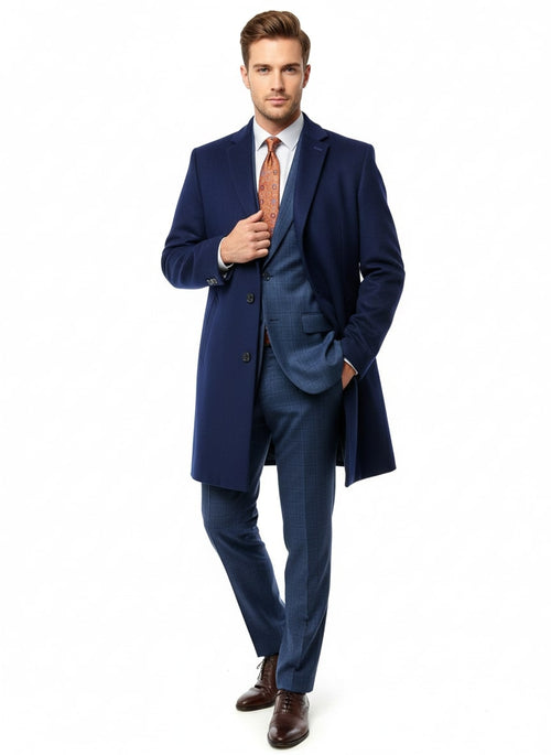 Cobalt blue wool-cashmere car coat. Straight silhouette, elongated length, single-breasted. Notch lapels, three front buttons. Fully lined, subtle cuff detail. Smooth fabric texture.