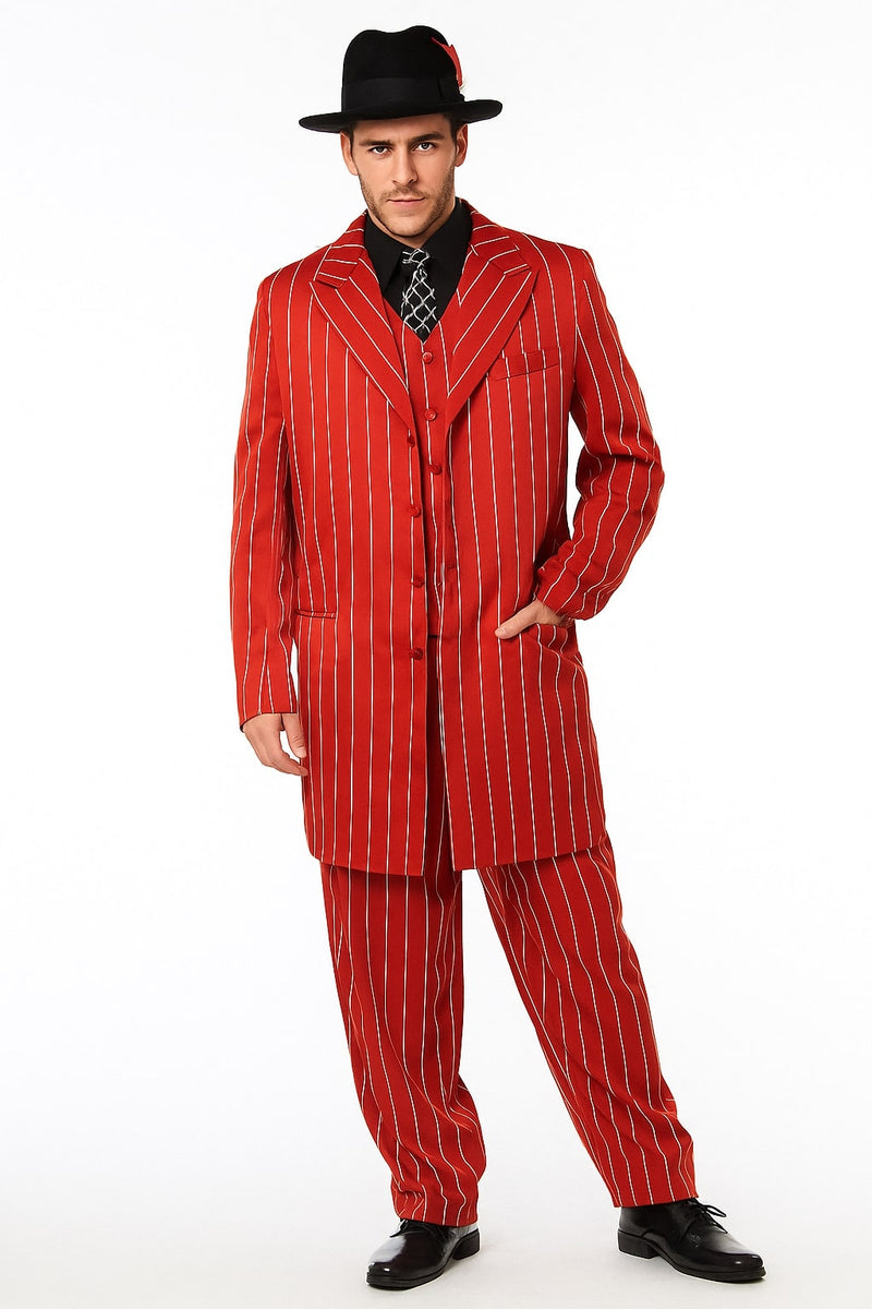 Men's red pinstripe zoot suit: long, structured jacket with flared lapels, wide-legged pants. Smooth fabric, red/white vertical stripes. Jacket: tailored fit, front pockets. Outfit includes black shirt, patterned tie, black shoes. Bold, classic style.