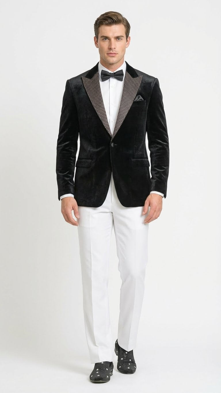 Men's black velvet tuxedo blazer with studded lapel, tailored fit, and long sleeves. Smooth, luxurious texture, single-button closure.