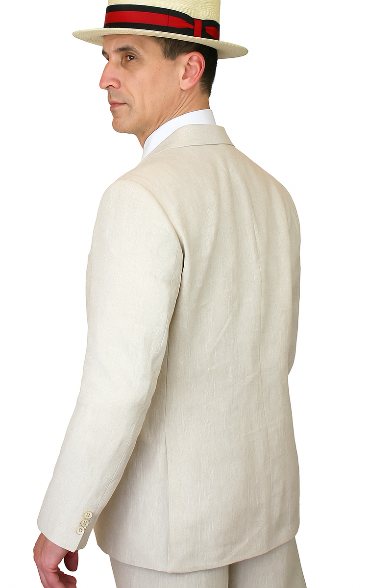 Riverdale linen coat in light beige. Tailored fit, long sleeves, and single back vent. Crafted from textured linen. Features button details for a structured design and crisp finish.