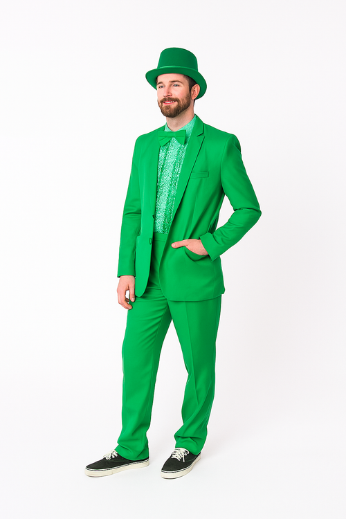 Vibrant green suit: fitted blazer, matching trousers, and hat. Textured green shirt underneath. Stylish and coordinated, offering a bold, monochromatic look.