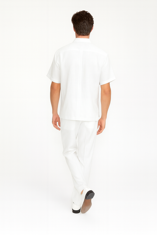 Men's white linen guayabera set: short-sleeve embroidered shirt & slim-fit pants. Shirt features front embroidery & back pleat. Perfect for warm weather.