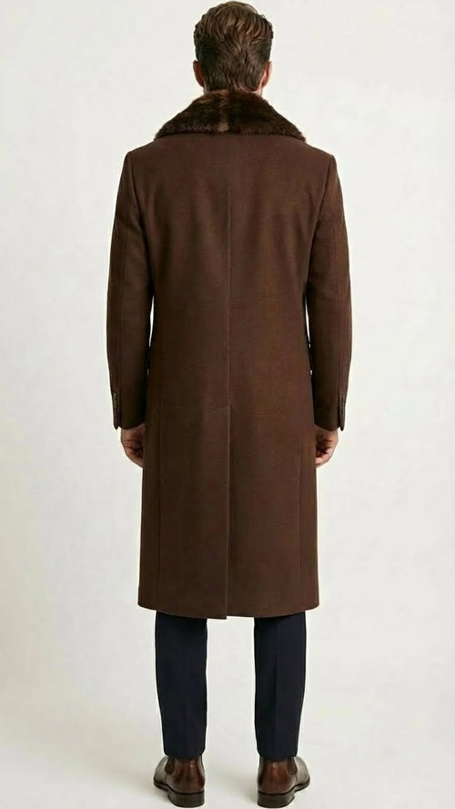 Men's brown long overcoat with faux fur collar, tailored fit, and straight hem. Wool-like material, long sleeves with buttoned cuffs.