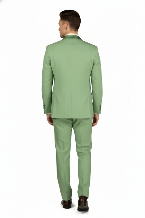 Mint green men's 2-piece tuxedo suit: slim-fit jacket with single back vent, notch lapels. Matching tapered trousers with side pockets. Smooth fabric.