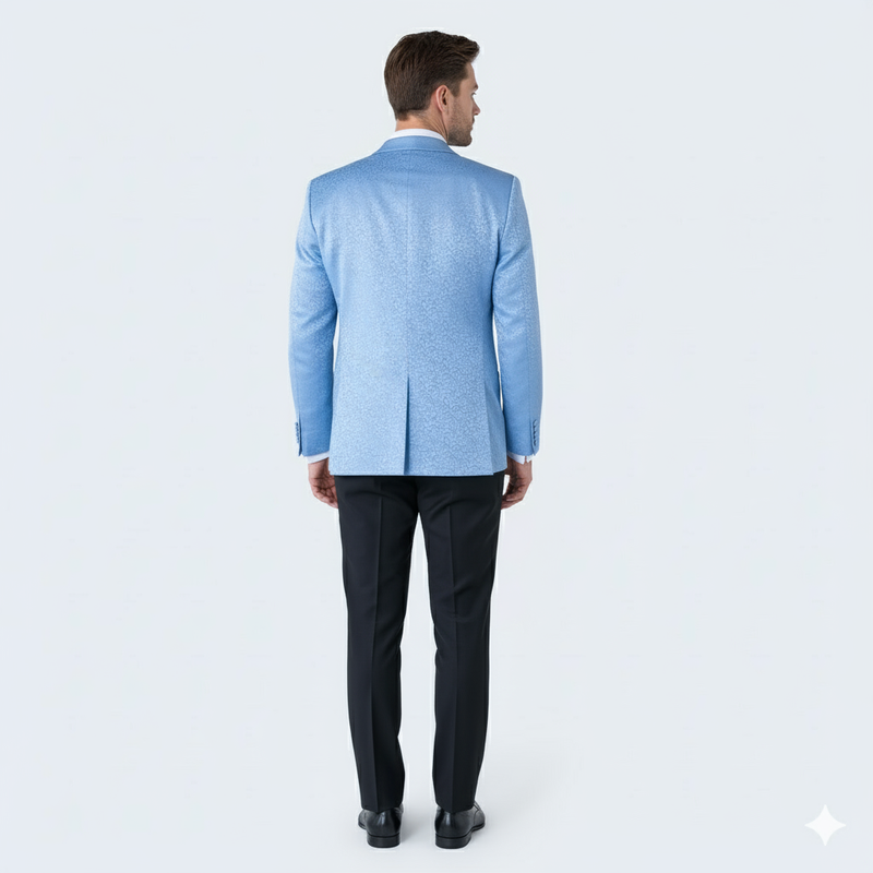 Men's light blue paisley tuxedo jacket with textured pattern & single back vent. Paired with black trousers. Structured, tailored fit.