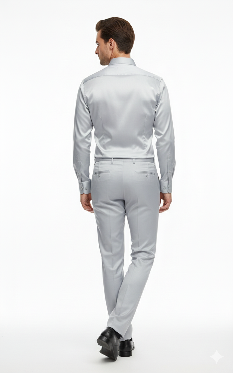 Silver satin slim-fit outfit: back view. Dress shirt with classic collar and button cuffs. Matching pants with a smooth finish and rear pockets.