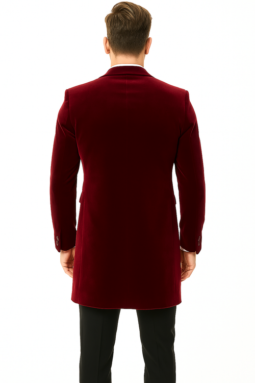 Men's burgundy velvet tuxedo with tailored blazer. Features: smooth texture, single back vent, two cuff buttons. Luxurious, classic formal wear.
