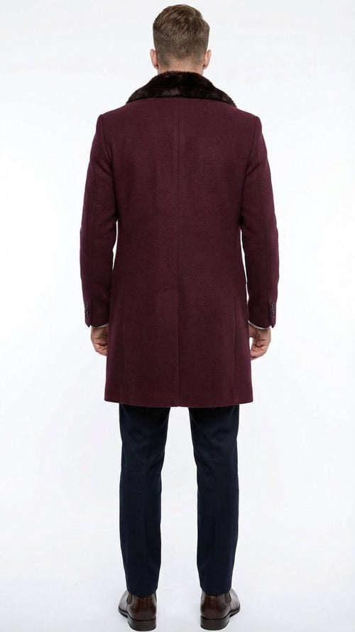 Men's burgundy three-quarter coat with faux fur collar. Sleek design, tailored structure, and straight cut. Features long, fitted sleeves with button cuffs. Made from wool-like material.