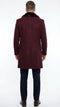 Men's burgundy three-quarter coat with faux fur collar. Sleek design, tailored structure, and straight cut. Features long, fitted sleeves with button cuffs. Made from wool-like material.