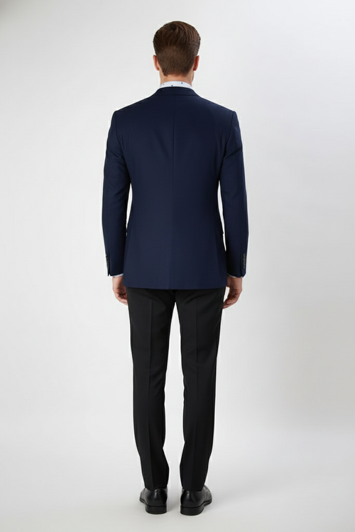 Men's navy double-breasted blazer. Tailored fit, peak lapels, and structured silhouette. Features a smooth navy fabric, button details, and single back vent.