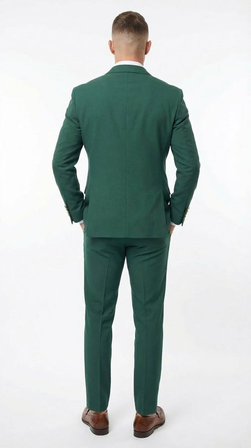 Emerald green double-breasted suit, featuring a structured design with a tailored fit. The suit has a pair of trousers matching the jacket, both made from a visible textured fabric.