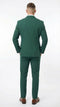 Emerald green double-breasted suit, featuring a structured design with a tailored fit. The suit has a pair of trousers matching the jacket, both made from a visible textured fabric.