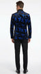 Men's black and royal blue patterned blazer features a velvet texture with intricate blue floral designs against a black background, showcasing structured shoulders and tailored fit.