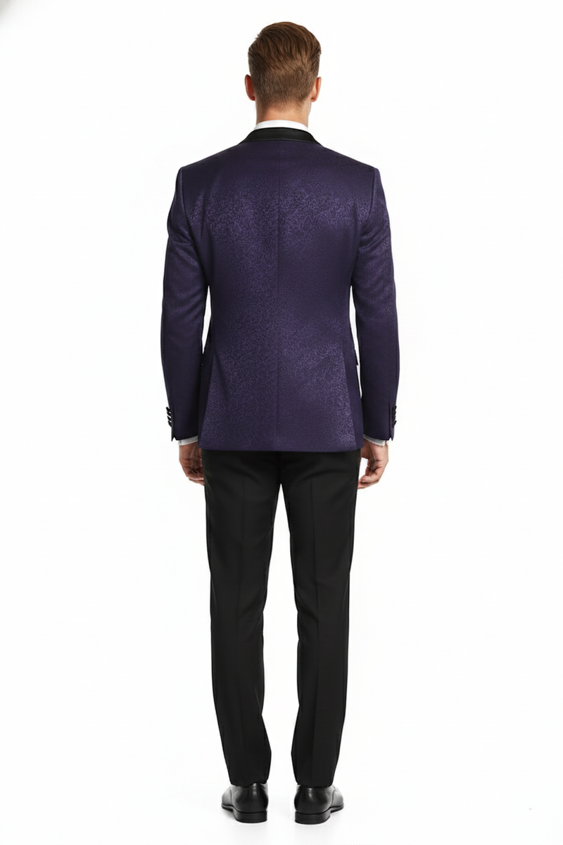Purple paisley tuxedo jacket. Structured, tailored silhouette. Features black notch lapel and covered buttons. Intricate paisley pattern on rich purple. Smooth back. Lustrous blend of materials. Elegant design.