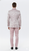 Men's dusty rose tuxedo with floral pattern. Textured jacket, fitted trousers. Perfect for a stylish event.