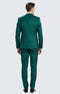 Men's emerald green three-piece suit. Textured fabric, tailored jacket with structured shoulders, tapered trousers, and matching vest. Sleek silhouette with consistent, rich emerald color.