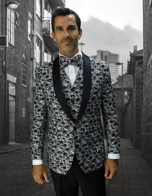 Black men's tuxedo with floral pattern and shawl lapel. Includes a matching vest, white cuffs, and a tailored formal fit. Features a black and white textured floral design.