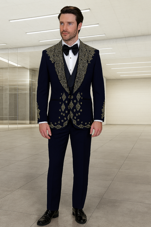 Navy tuxedo with shawl collar, gold embroidery on shoulders and front. Smooth, tailored fabric. Matching straight-cut trousers. Embellishments enhance the jacket's design.