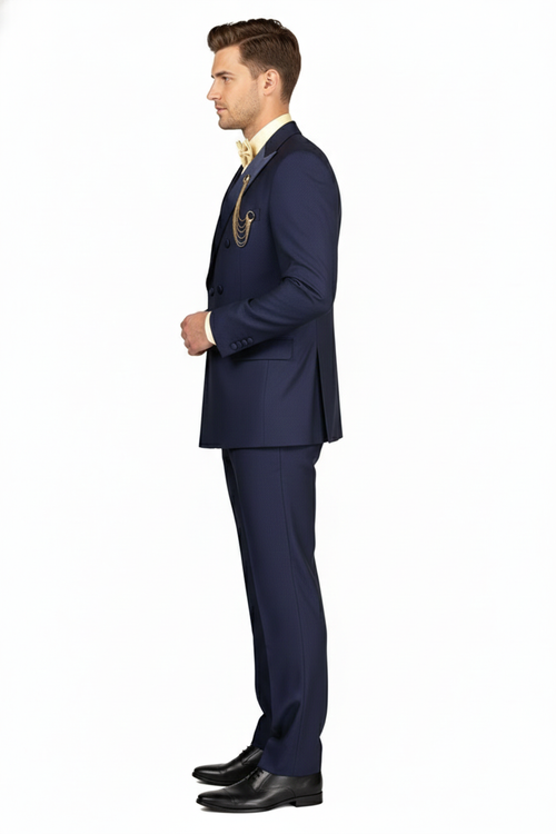 Navy double-breasted tuxedo with satin peak lapel. Tailored fit, structured silhouette, smooth fabric, and matching trousers. Classic navy blue.