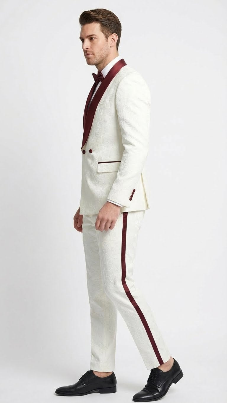 Ivory jacquard tuxedo suit with burgundy accents. Double-breasted jacket, burgundy shawl lapel & buttons. Burgundy stripe on trousers. Elegant ivory & burgundy color scheme.