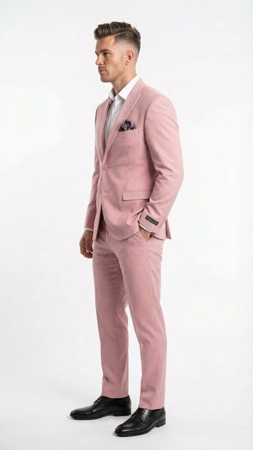 The vitali brand modern fit men’s light pink formal suit features a tailored jacket with a single-button closure, a matching pair of slim-fit trousers, and a pink floral pocket square.