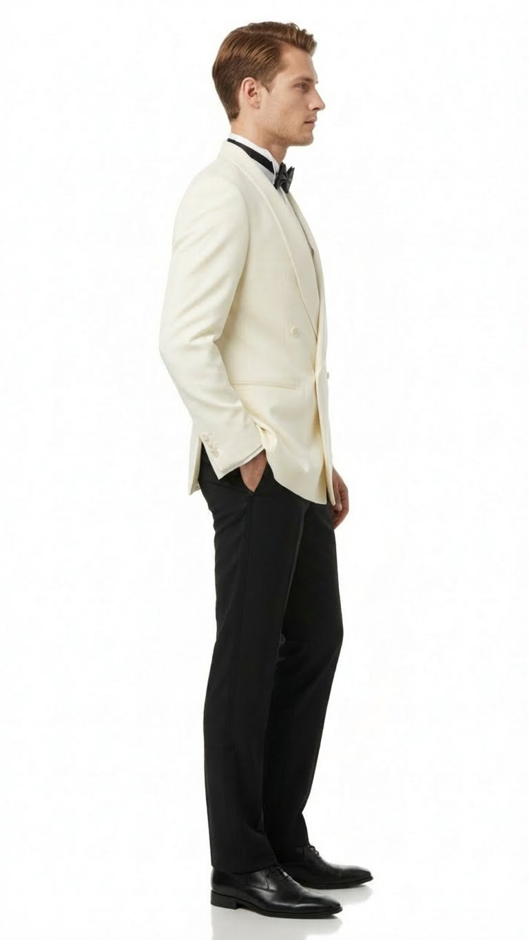 Ivory double-breasted tuxedo jacket with shawl lapels. Structured fit, smooth fabric, and long sleeves. Ideal for formal events, paired with black trousers.