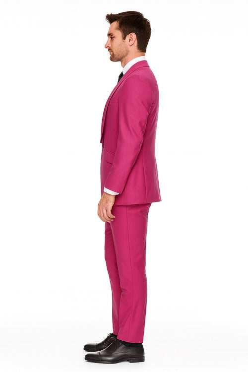 Men's hot pink tuxedo set. Shawl lapel jacket, fitted with side seams and breast pocket. Tailored straight-leg pants. Smooth, glossy fabric for a vibrant, uniform look.