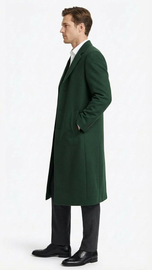 Alberto Nardoni men's hunter green wool overcoat. Full length, straight cut, structured silhouette. Dense wool, notched lapel, single-button closure, two side pockets. Tapering sleeves, solid design, longer back.