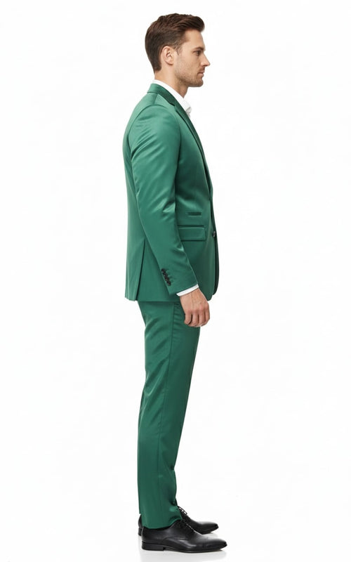 Men's slim fit suit set in shiny emerald green sateen. Blazer: classic lapel, button closure, two pockets. Pants: straight leg. Fitted silhouette.