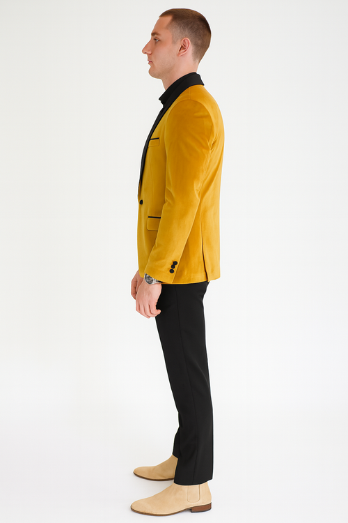 Alberto Nardoni men's mustard gold velvet tuxedo jacket. Fitted, single-breasted design with black trim. Features a vibrant velvet texture, black lapel & pockets, flap pockets, & 3-button sleeves.