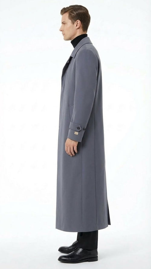 Alberto Nardoni charcoal grey overcoat. Full-length, straight silhouette with tailored fit. Traditional collar, long sleeves, and smooth fabric. Side slant pocket, buttoned cuffs. Minimalist design, extends below knees.