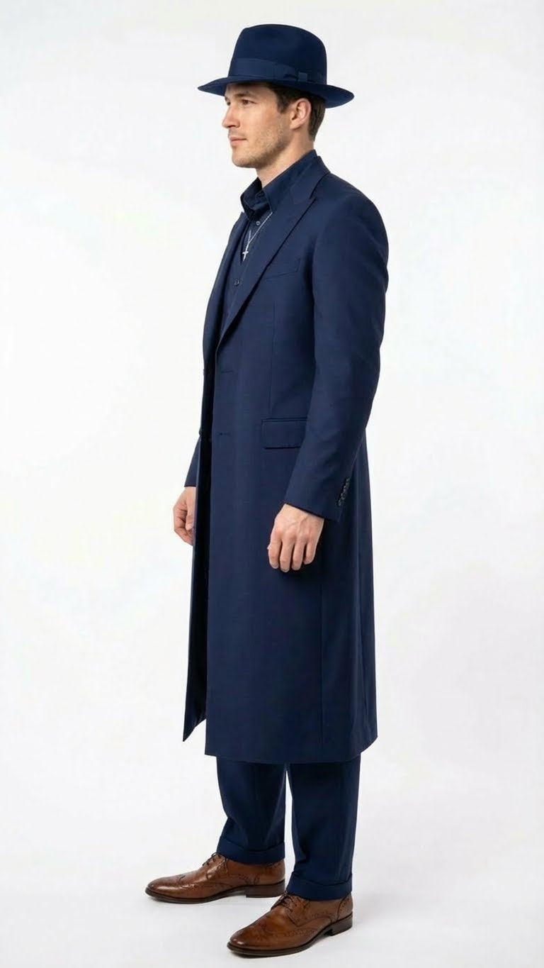 Navy blue 1920s zoot suit: long jacket with wide lapels, tailored trousers, and matching hat. Smooth fabric, jacket pocket. Loose-fit, tapered pants. Brown leather shoes with decorative pattern.