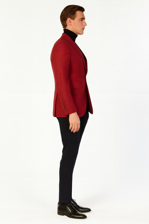 Men's burgundy sport coat. Tailored, single-breasted, two-button design. Smooth fabric, notched lapels, and side pockets. Structured with long sleeves, buttoned cuffs. Solid color, versatile for formal or smart-casual wear, offering a refined look.