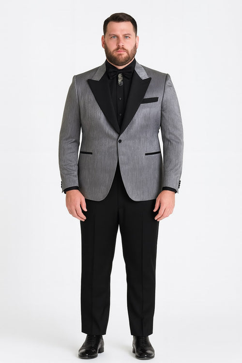 Silver metallic tuxedo suit with black satin peak lapel and textured jacket. Solid black tailored trousers. Includes black shirt and bow tie for a formal look.