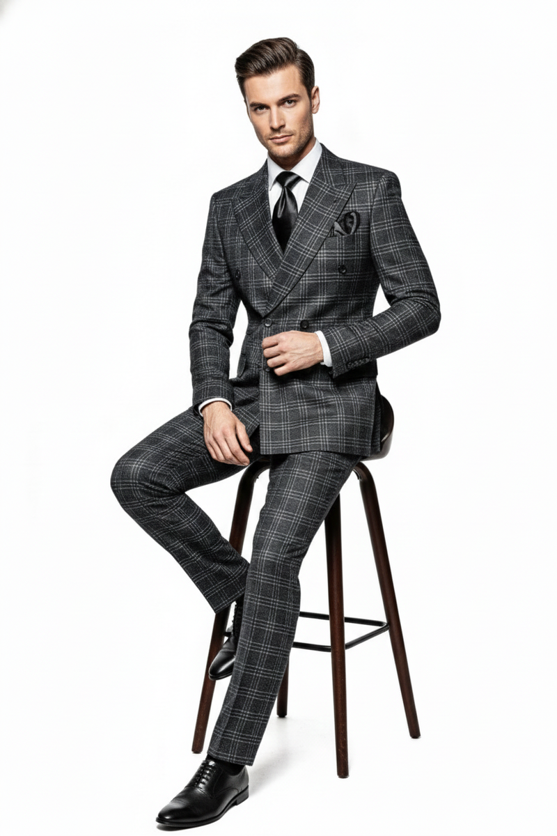 Charcoal plaid double-breasted men's suit with wide peaked lapels and tailored fit. Features coordinated dark/light gray plaid. Includes slim-fit trousers with matching pattern and front pockets.