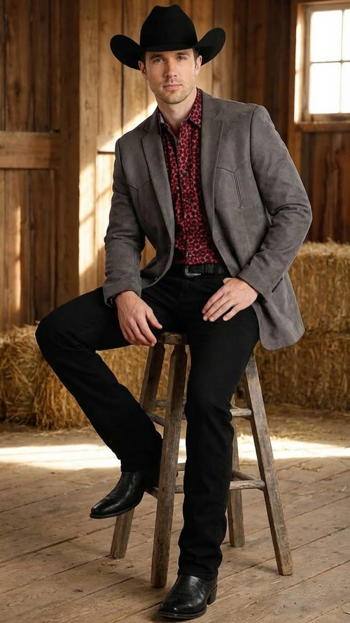 Men’s brown western faux suede blazer by Alberto Nardoni features a tailored fit with a notched lapel and two front pockets. The blazer has a smooth, textured appearance in a muted brown hue.