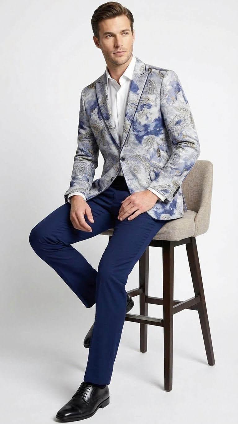 Navy and gray paisley men's blazer. Slim fit, structured shoulder, single-breasted. Features intricate paisley patterns, notch lapels, and textured fabric. Includes flap pockets and single-button closure.