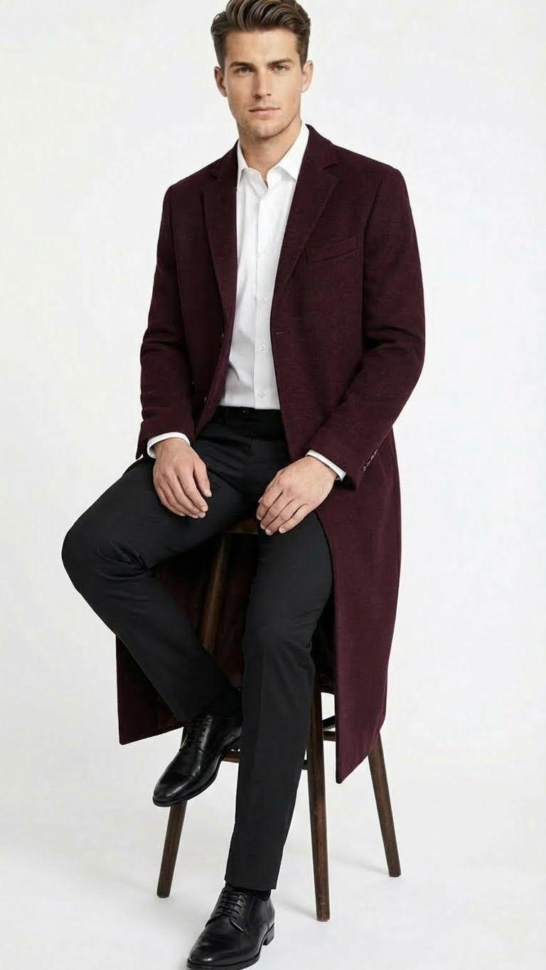 Men's burgundy long coat in wool blend. Classic fit, single-breasted, notch lapels, side pockets. Knee-length, straight silhouette.